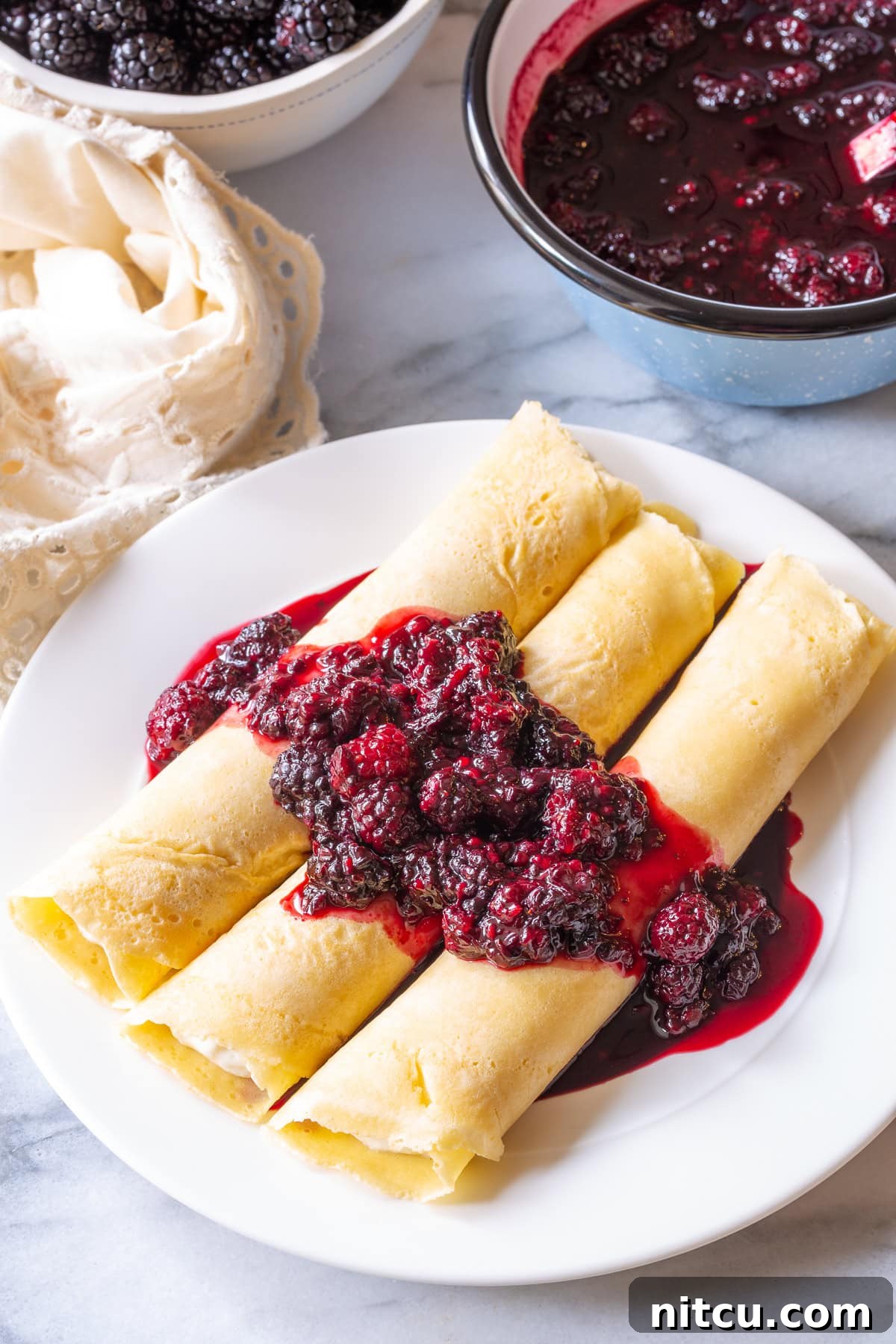Golden Cheese Blintzes 8 Drizzling warm, rich blackberry sauce over freshly prepared blintz pancakes