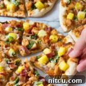 Umami Grilled Teriyaki Chicken Pizza 12 Grilled Chicken Teriyaki Pizza with pineapple and bacon, presented on a plate.
