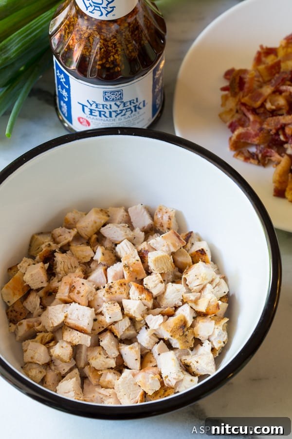 Umami Grilled Teriyaki Chicken Pizza 6 Bowl full of cooked grilled chicken that is chopped into pieces.