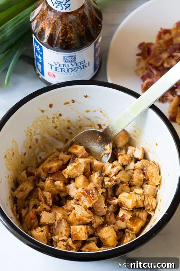 Umami Grilled Teriyaki Chicken Pizza 7 Bowl full of chopped, grilled chicken being marinaded in teriyaki sauce, ready for pizza.