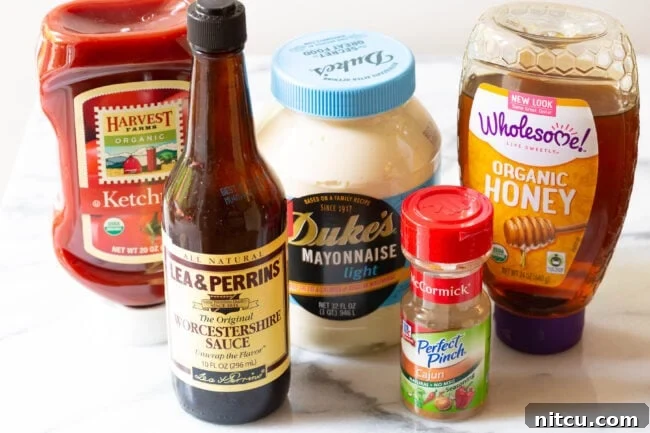The Encore Sauce 3 A collection of ingredients artfully arranged on a marble surface, ready to be transformed into Southern Comeback Sauce.