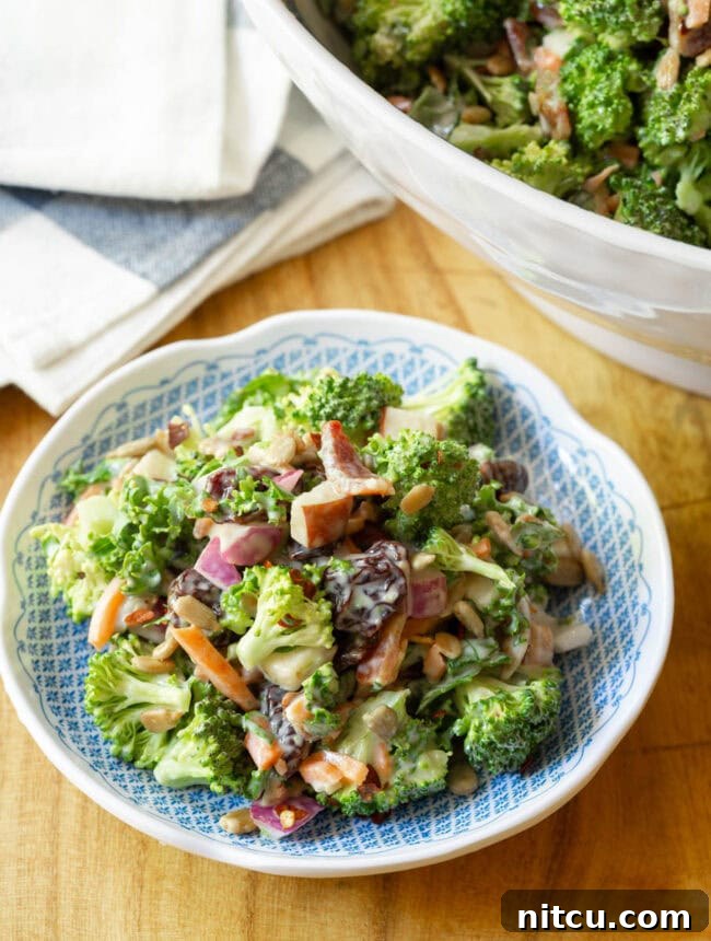 A beautifully arranged plate of broccoli slaw salad, showcasing its vibrant colors and appealing textures.