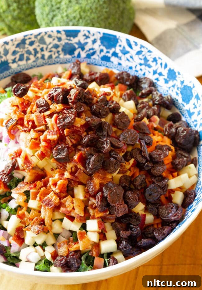 Close-up of finely chopped red onion, adding a sharp, vibrant element to the salad.