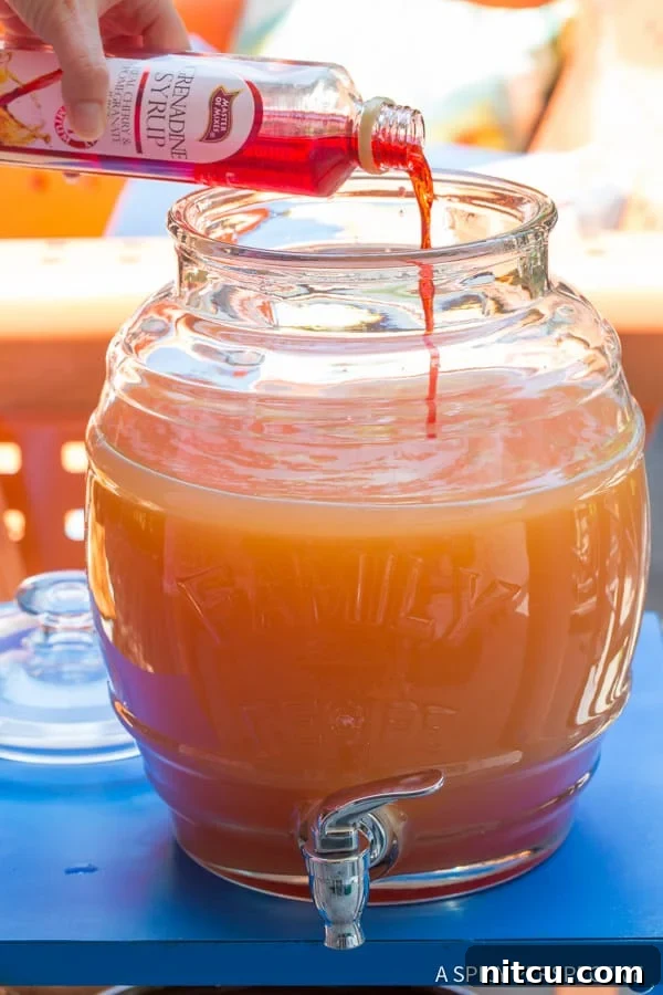 Pouring Grenadine into Rum Punch Adding Grenadine Syrup to Rum Punch, enhancing color and flavor