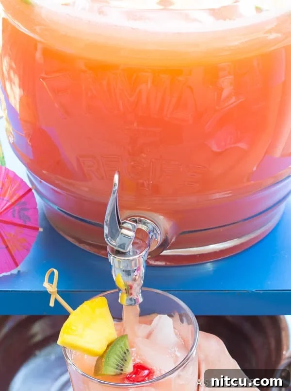 Serving a Rum-based Summer Drink Summer Drink with Rum pouring into glass from a bottle