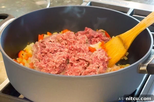 Easy Skillet Sloppy Joe Noodle Dinner 7 Step 2: Adding tomato products to the One-Pot Sloppy Joe Noodle Skillet