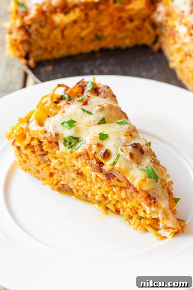 Individual slices of baked spaghetti pie arranged on a serving platter.