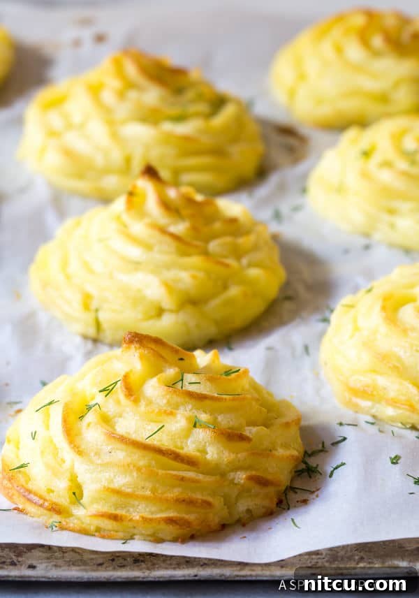 Perfect Duchess Potatoes 2 The Best Duchess Potatoes Recipe - close up on baking sheet