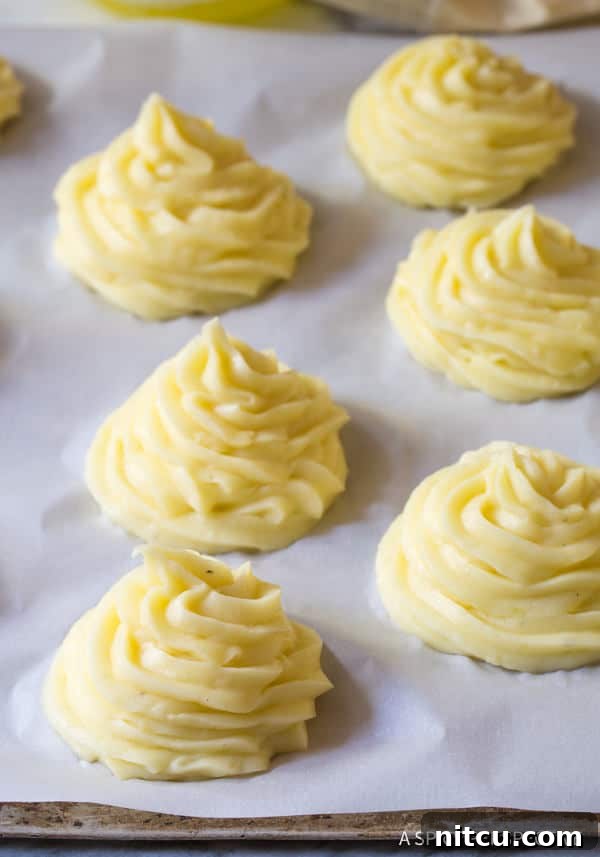 Perfect Duchess Potatoes 5 Duchess Baked Potato Recipe piped on baking sheet