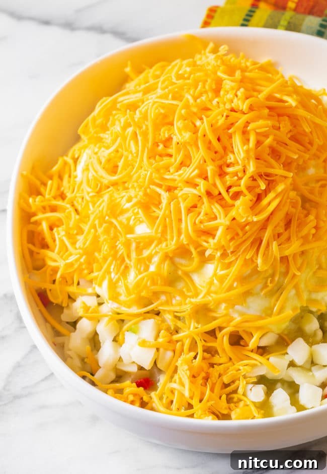 Signature Social Spuds 9 Potato mixture topped with cheese.