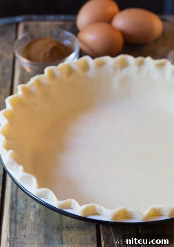 Pie crust in a pie pan before being baked. 