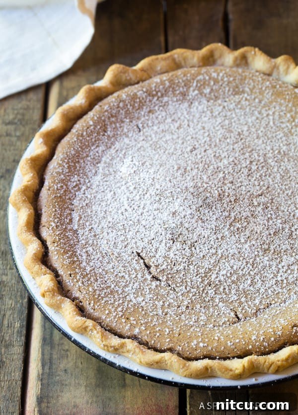 Cinnamon pie after being baked and dusted with powdered sugar. 