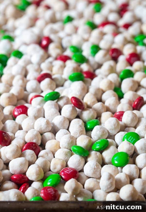 6-Ingredient Snowball Party Mix featuring Kix cereal, white chocolate, peanut butter, and cinnamon
