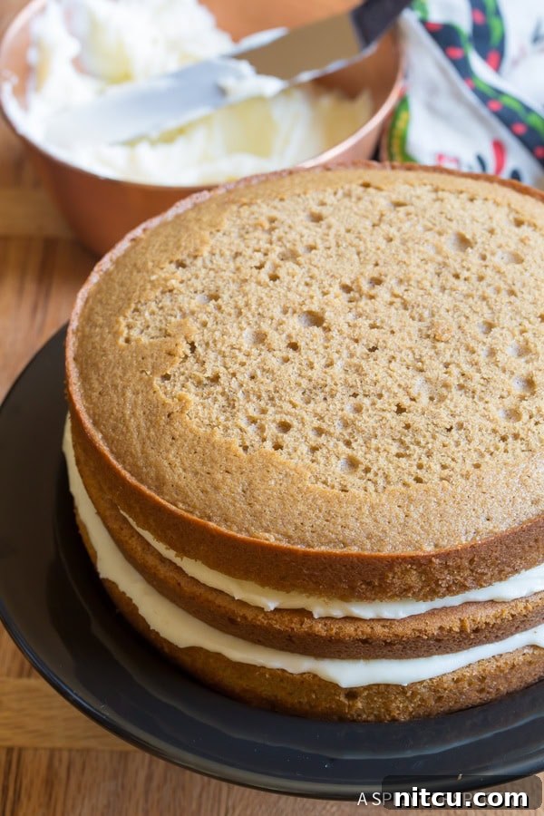 Perfectly sliced Cinnamon Dolce Latte Cake with Mascarpone Frosting, ready to serve.