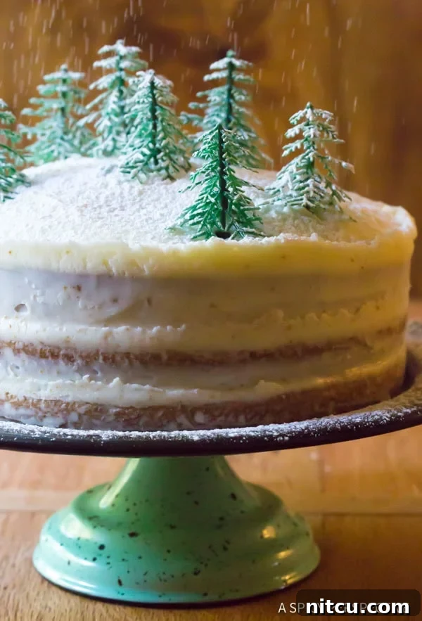 Ultimate Cinnamon Dolce Latte Cake with Mascarpone Frosting, elegantly presented on a cake stand.