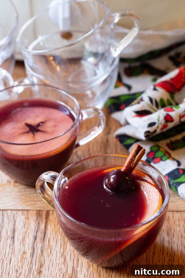 Spiced Holiday Wassail 7 Christmas Drink - Mulled Wine Wassail Recipe in small glass mugs