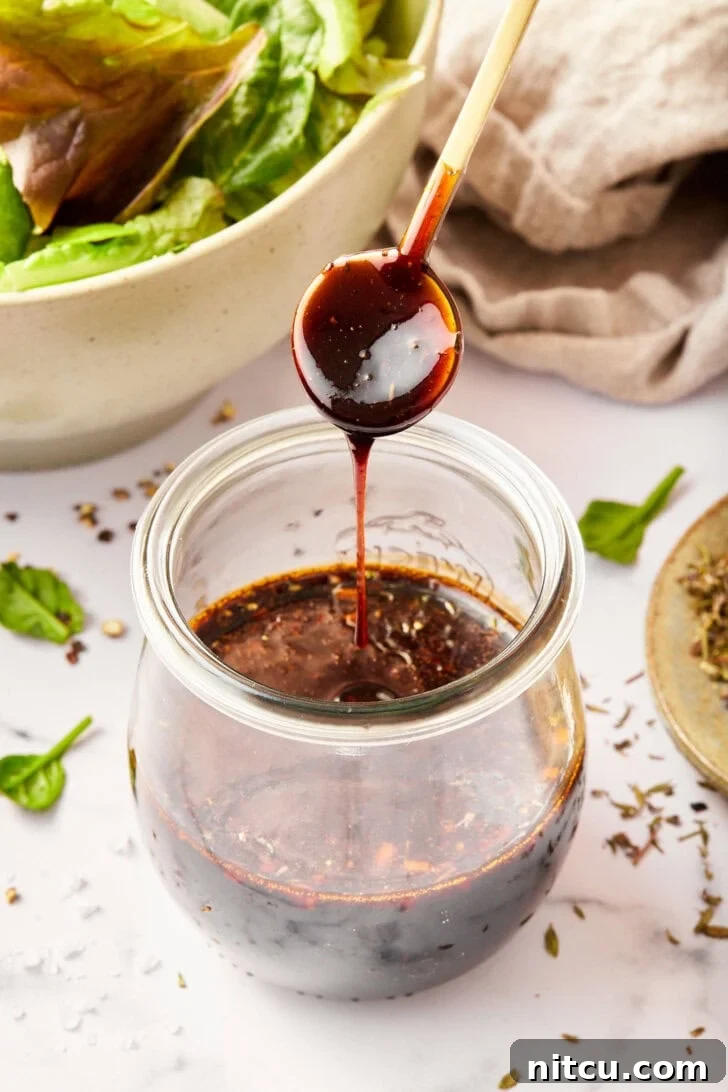 Elevate Your Salad with Homemade Balsamic Vinaigrette 3 homemade balsamic salad dressing with balsamic vinegar poured over jar