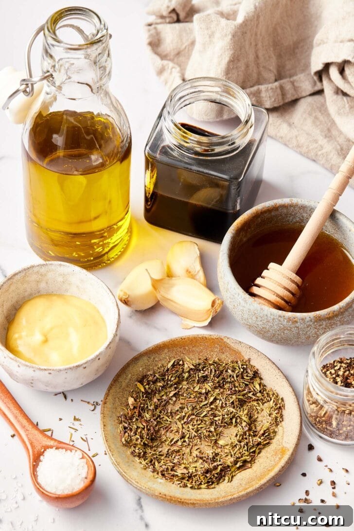 Elevate Your Salad with Homemade Balsamic Vinaigrette 4 Ingredients needed for balsamic dressing recipe on counter.