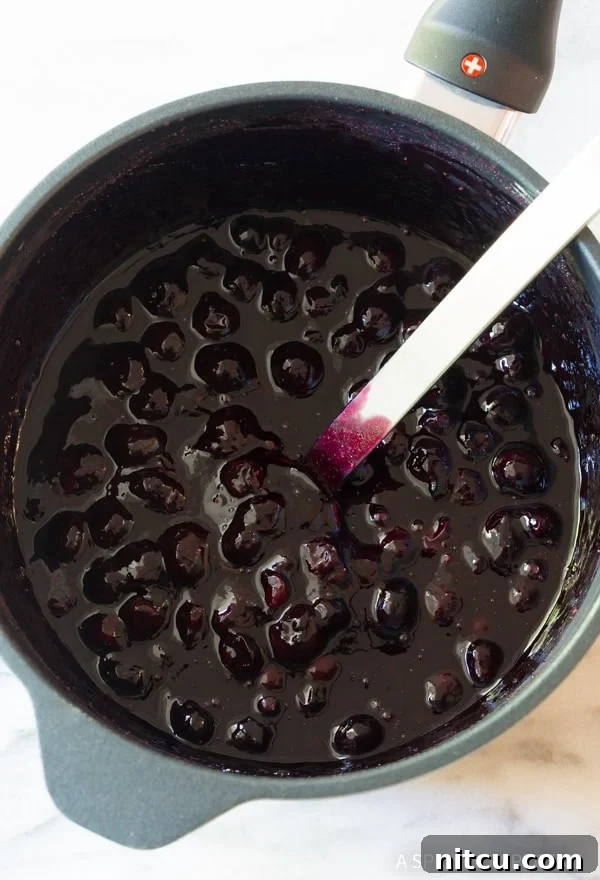 Homemade Blueberry Ice Cream Sauce 4 Blueberry sauce simmering in a saucepan.