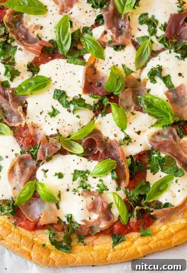 Light & Low Carb Cloud Pizza 3 Close up shot of the toppings on top of cloud bread pizza.