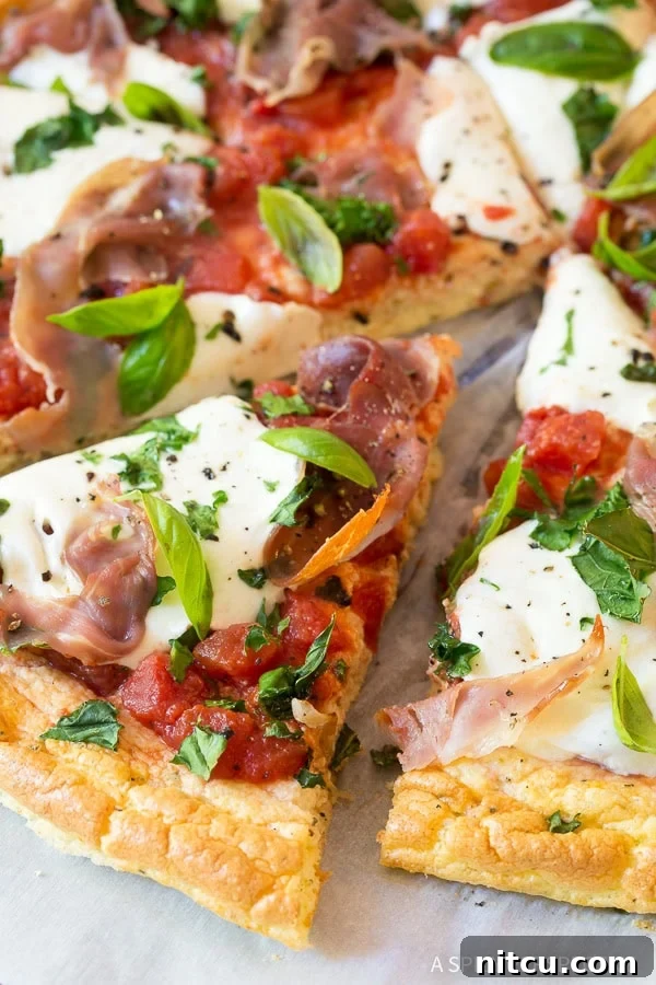 Light & Low Carb Cloud Pizza 4 Low carb cloud bread pizza sliced into pieces.