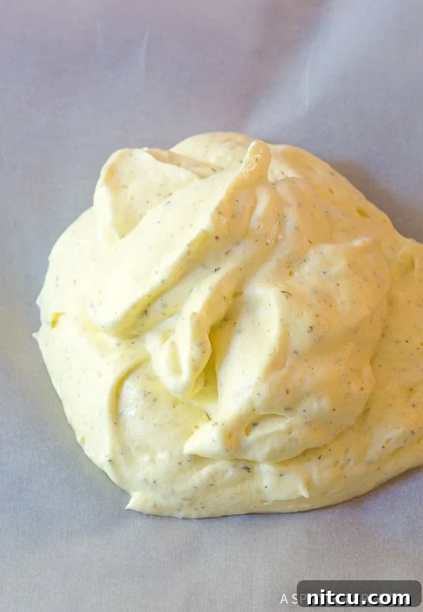 Light & Low Carb Cloud Pizza 6 Cloud bread dough on a baking sheet.