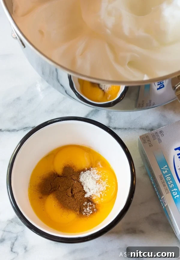 Pillowy Cloud Bread Pancakes 4 Egg yolks, cinnamon and stevia in a bowl.