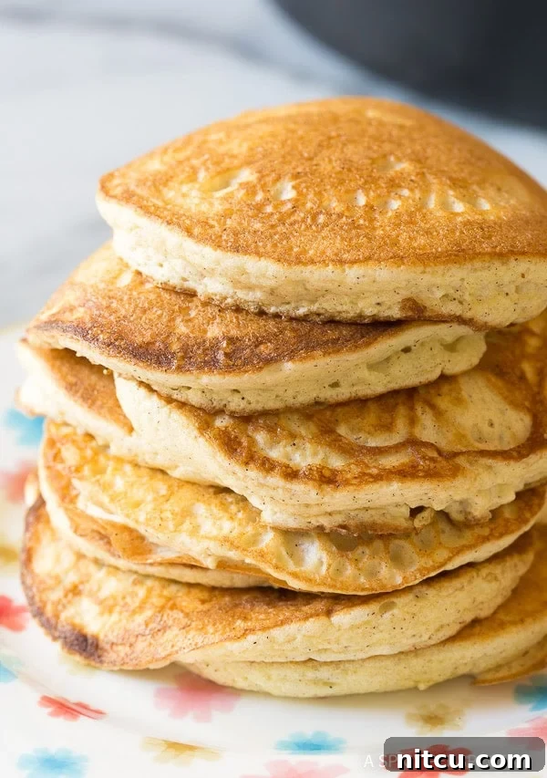 Pillowy Cloud Bread Pancakes 7 Fluffy Low Carb Cloud Bread Pancakes stacked on a plate