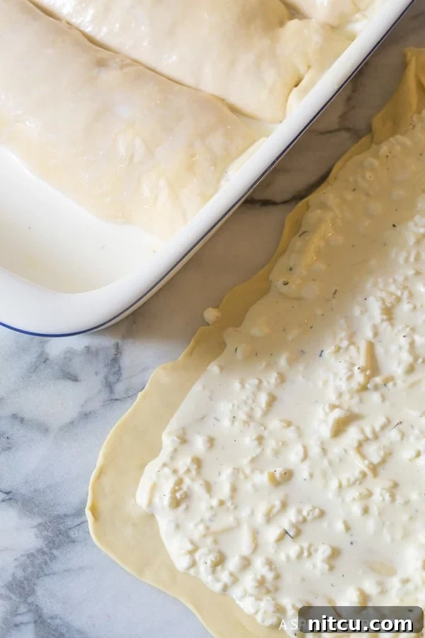 Dough rolled very thin and topped with the cheese mixture. 