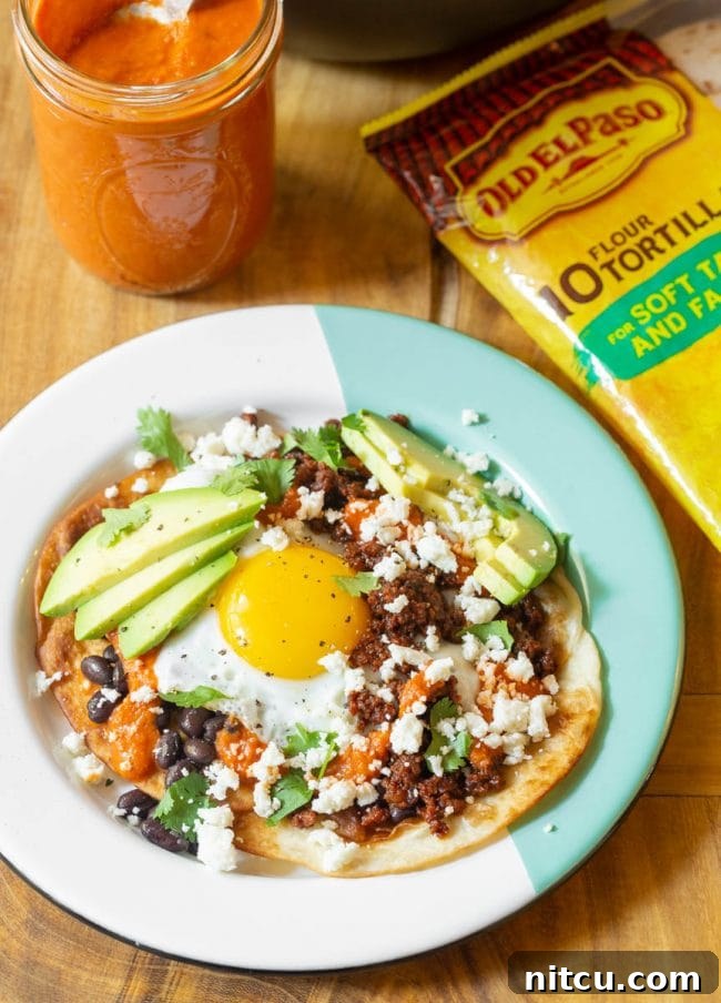 Hearty Ranch Eggs with Zesty Salsa 5 Ingredients for Huevos Rancheros laid out on a table, including tortillas, eggs, and chorizo.