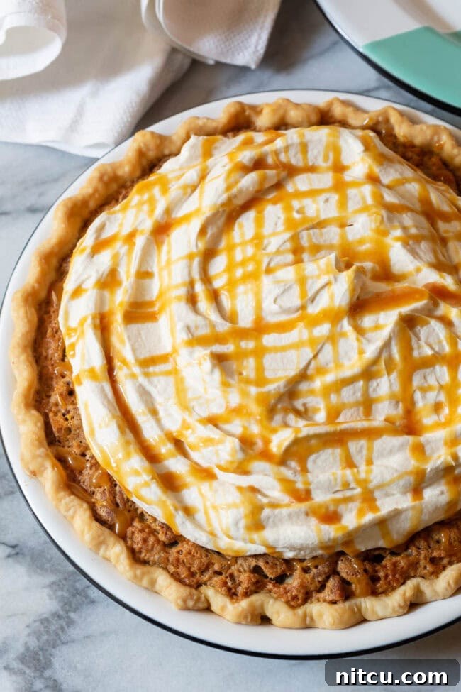 salted-caramel-whipped-cream A generous dollop of fluffy salted caramel whipped cream crowns a slice of Kentucky Derby Pie.
