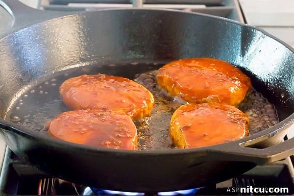 Illustrative image showing how to make Pan Fried Pork Chops, demonstrating the cooking process.