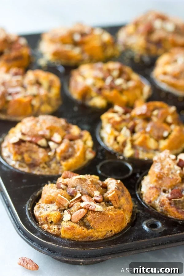 Sticky Bun Bread Pudding Muffin Cups 6 Warm Cinnamon Roll Bread Pudding Muffins cooling on a wire rack