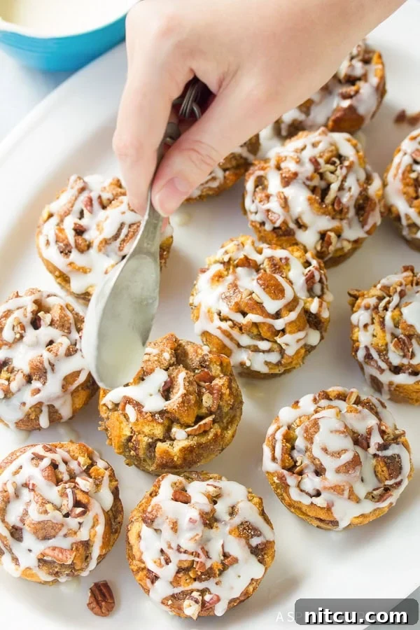 Sticky Bun Bread Pudding Muffin Cups 9 Sprinkling cinnamon sugar on Cinnamon Roll Bread Pudding Muffins before baking