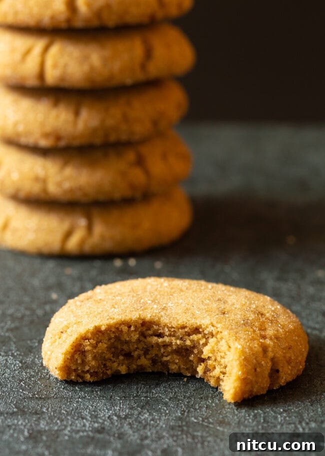 Nutty Brown Butter Delights 10 Brown sugar cookie recipe with a bite taken out, showing the soft interior.