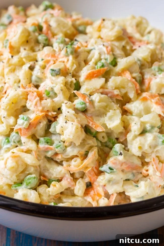 Creamy Hawaiian Macaroni Potato Salad 7 Macaroni salad in a large serving bowl, garnished and ready for serving.