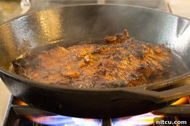 The Secret to Tender Carne Asada 8 A close-up of the smooth and vibrant Carne Asada marinade mixture.