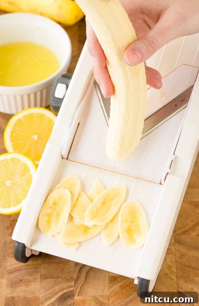 Crispy Banana Delights 4 Using a mandolin slicer to cut up the bananas
