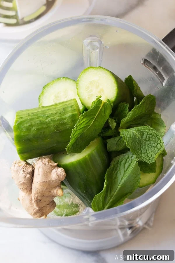 Crisp Cucumber Cooler 5 Ingredients for agua fresca in the blender before being blended.