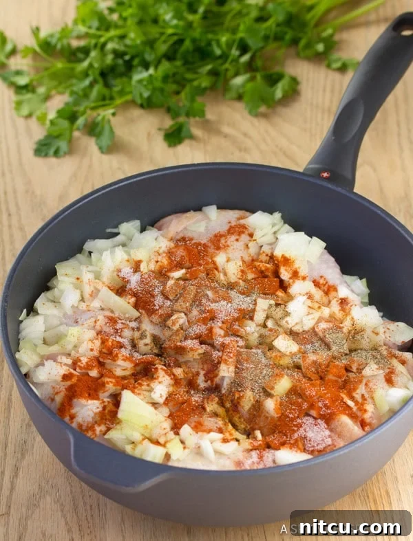 Soulful Hungarian Paprika Chicken 4 Chicken Paprikash simmering in a skillet with chopped onions and vibrant paprika