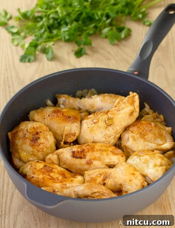 Soulful Hungarian Paprika Chicken 5 Browned chicken pieces in a skillet, ready for the Paprikash sauce