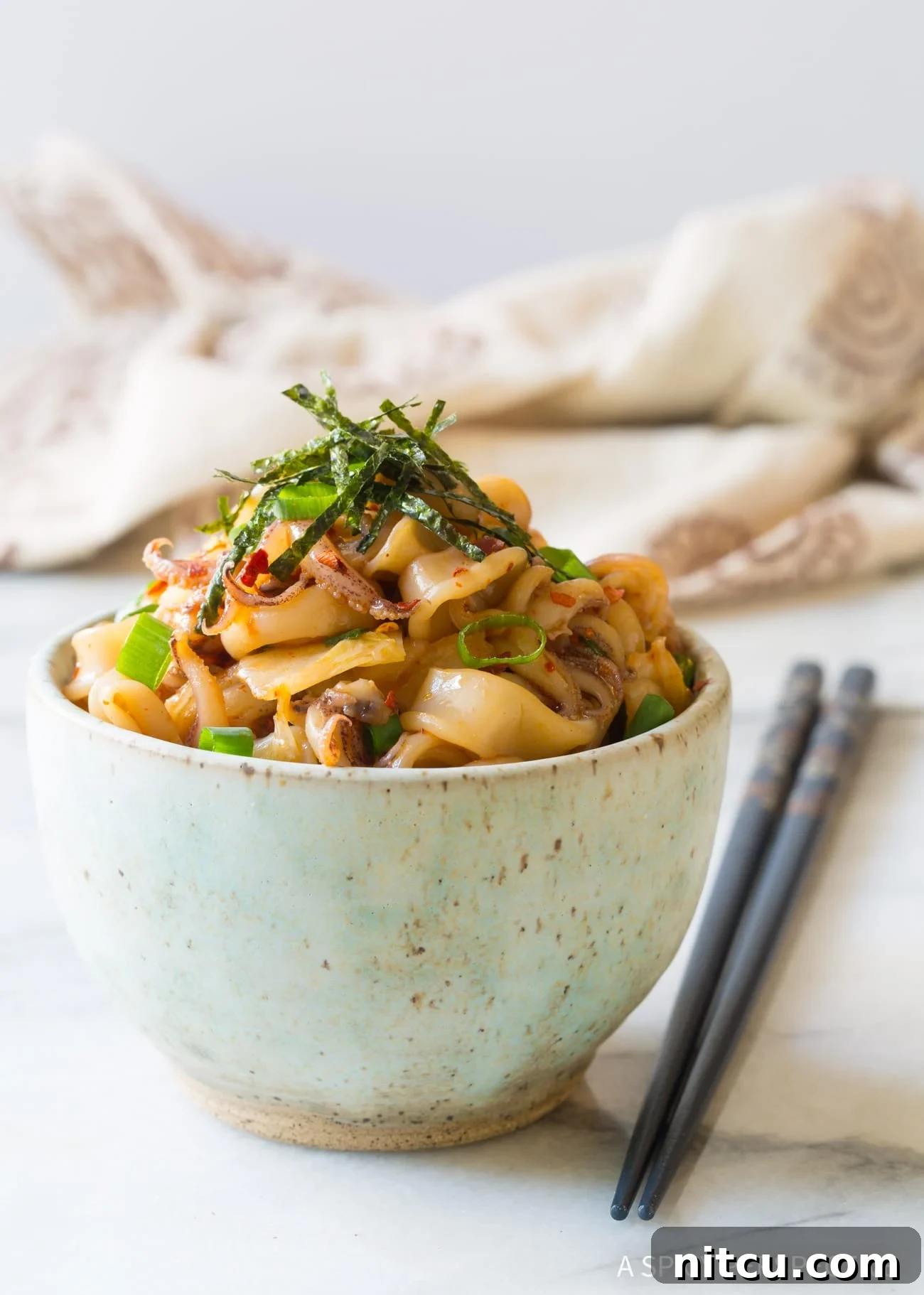 Vibrant Hawaiian Tako Poke 9 Octopus poke in bowl with chopsticks