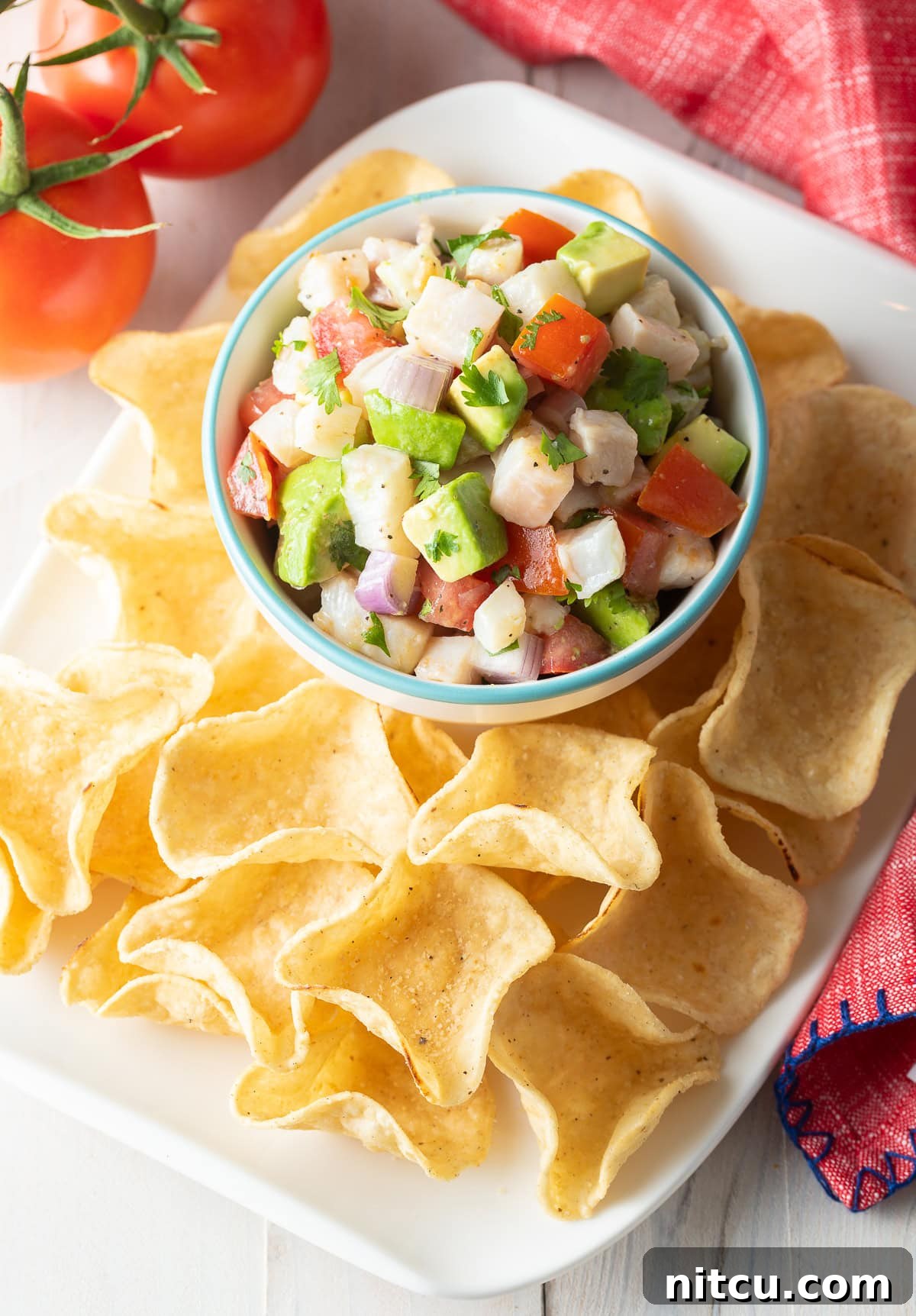 Swai-Fish Seafood Ceviche on platter with fresh avocado and tomato