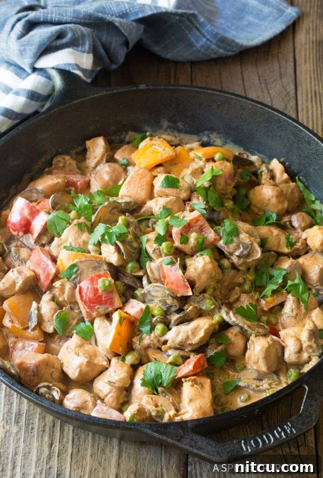 Lighter Chicken A La King 11 Finished Healthy Chicken A La King simmering in the skillet, ready to serve.