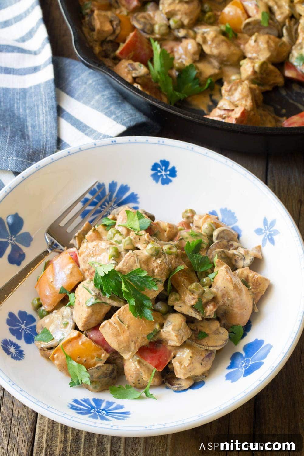 Lighter Chicken A La King 4 Plated Healthy Chicken a la King with a fork, ready to be enjoyed.
