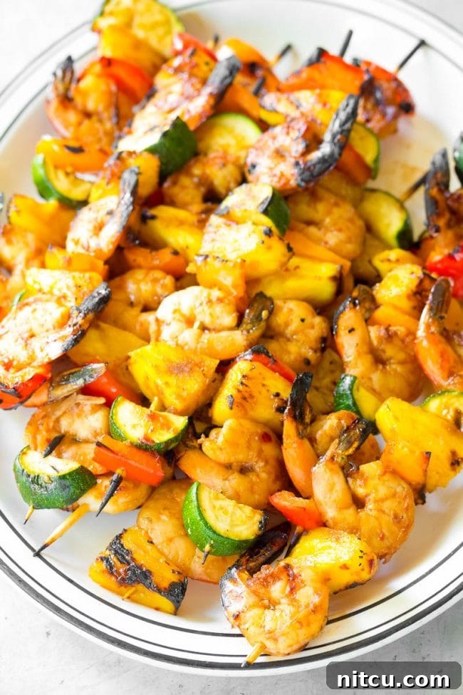 Sweet and Savory Glazed Teriyaki Shrimp 12 Final picture of the kebabs with shrimp and vegetables ready for consumption, perfectly arranged on a serving platter.
