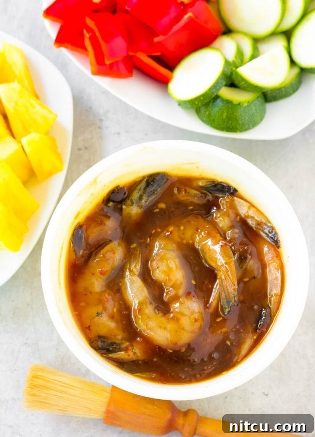 Sweet and Savory Glazed Teriyaki Shrimp 8 Shrimp soaking in a bowl of rich teriyaki marinade, absorbing all the flavors.