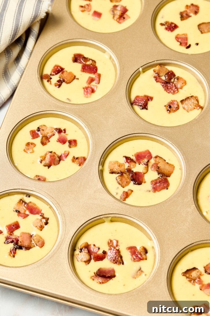 Golden Corn Muffins with Crispy Bacon 8 Corn muffin batter poured evenly into muffin pans