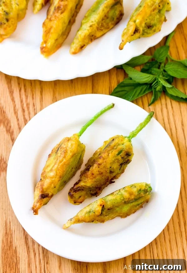 Artisanal Stuffed Squash Blossoms 3 Simple Market Stuffed Squash Blossoms Recipe, showing the golden-fried blossoms arranged beautifully.