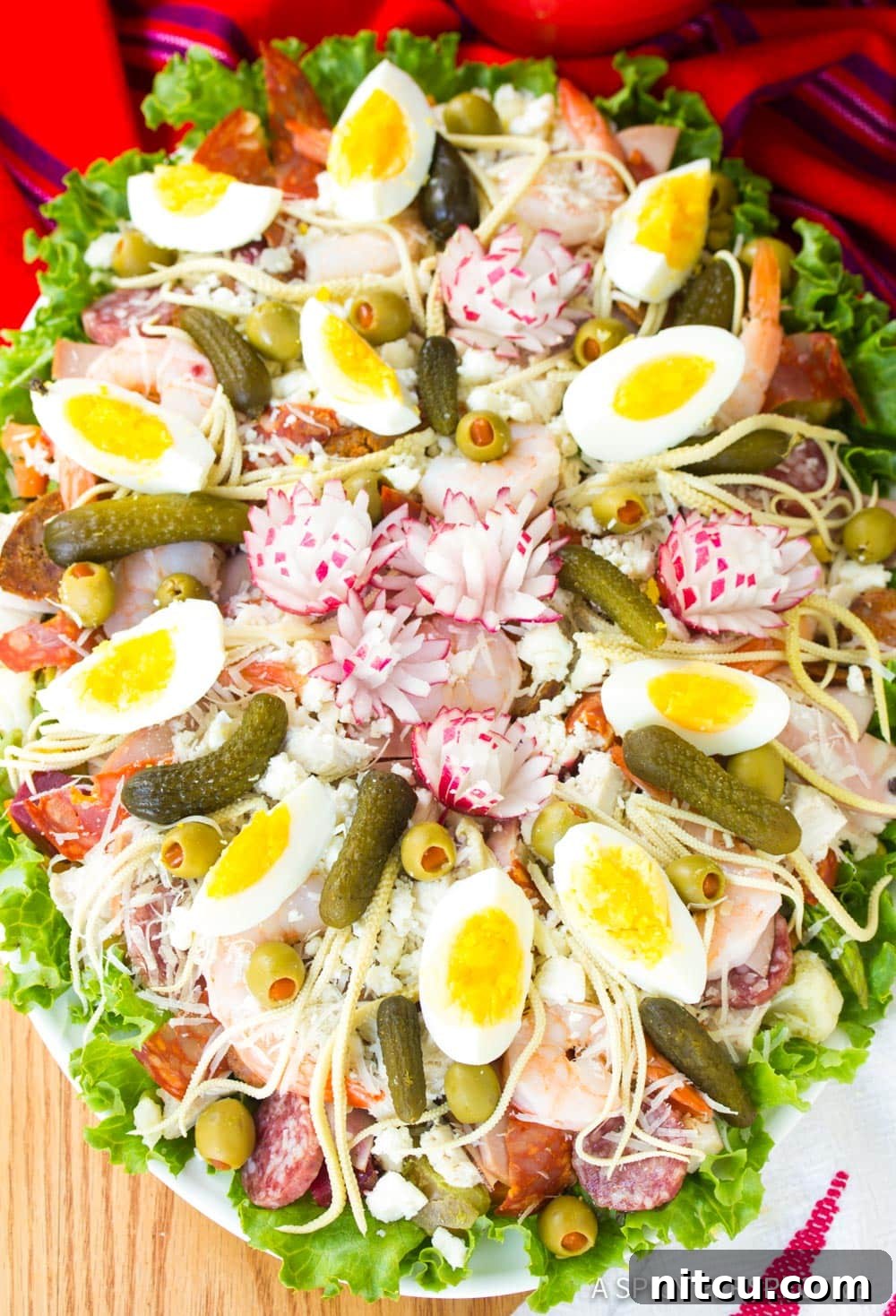 Layered Legacy: Guatemalan Fiambre 7 A finished large Guatemalan Fiambre salad, beautifully assembled with all its varied components, ready to be served.